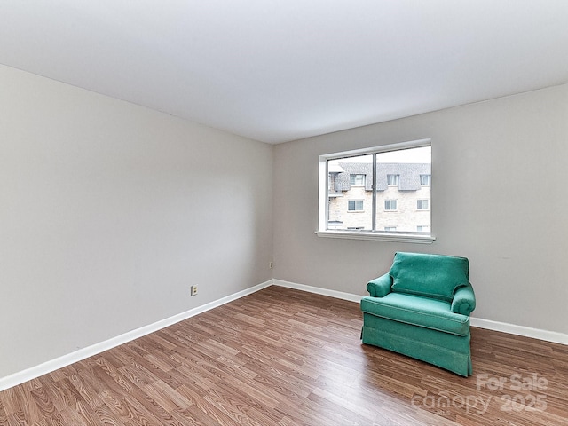 unfurnished room featuring hardwood / wood-style flooring