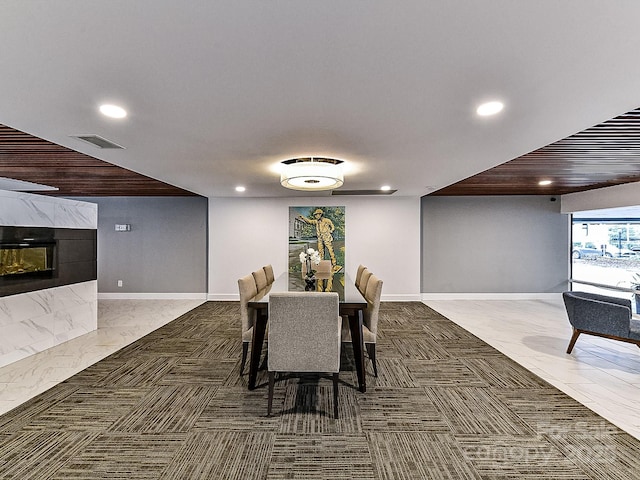 dining area with a tile fireplace