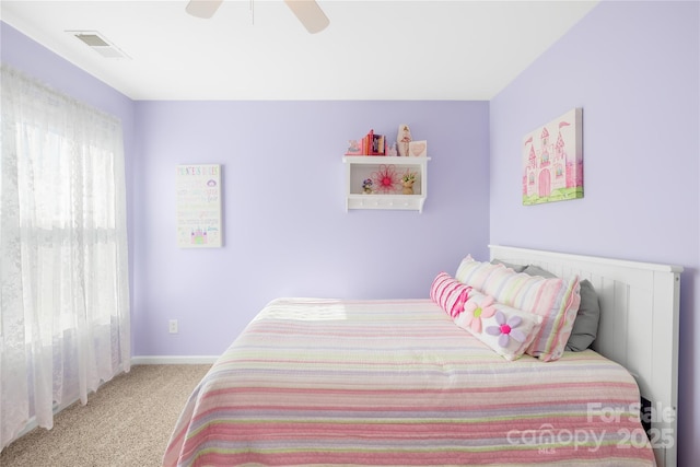 bedroom featuring light colored carpet and ceiling fan