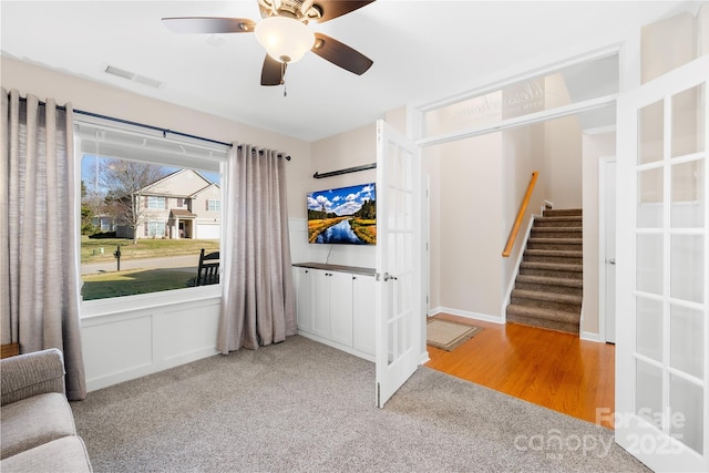 unfurnished room featuring carpet and ceiling fan