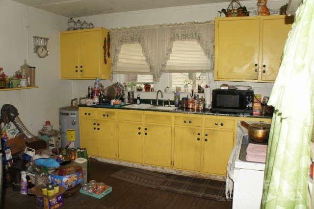 kitchen with white range oven and sink