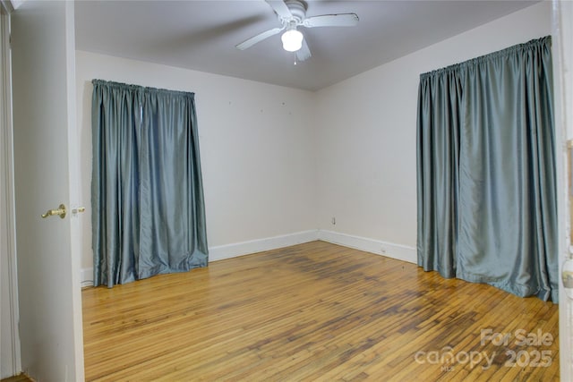 unfurnished room featuring hardwood / wood-style floors and ceiling fan