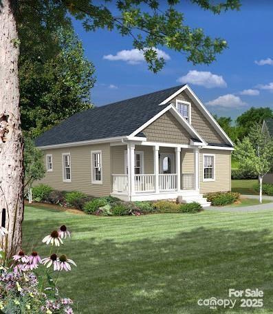 view of front facade featuring covered porch and a front yard