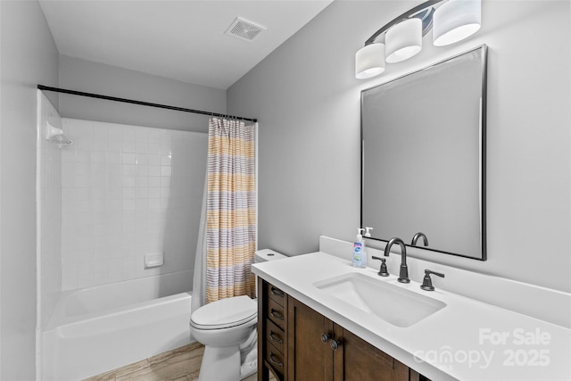 bathroom with visible vents, toilet, wood finished floors, shower / bath combination with curtain, and vanity