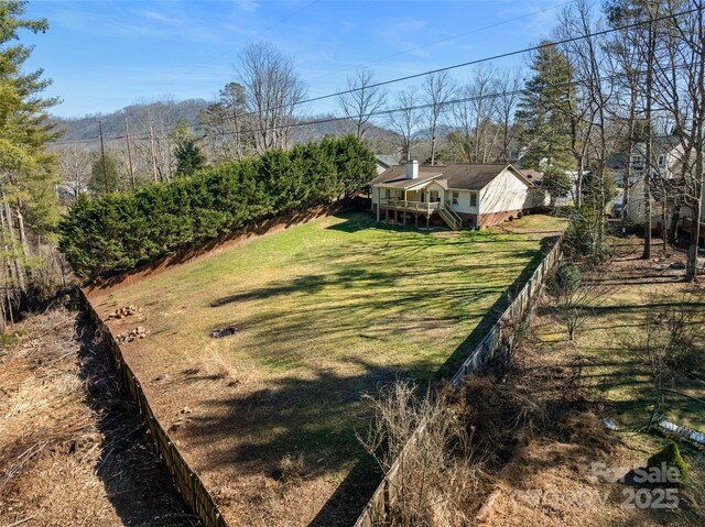 view of yard featuring a wooden deck and stairs