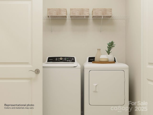 clothes washing area with laundry area and washing machine and dryer