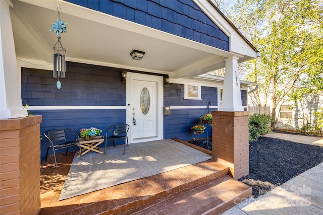 doorway to property with covered porch