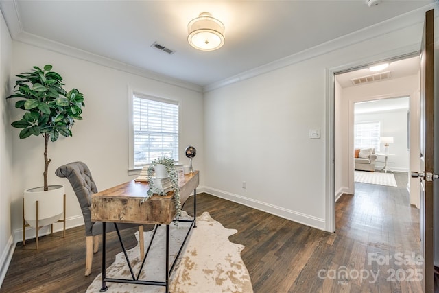 home office with plenty of natural light, visible vents, and crown molding