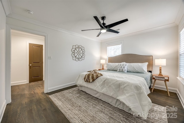 bedroom featuring ornamental molding, wood finished floors, a ceiling fan, and baseboards