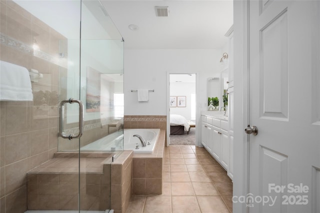 bathroom with tile patterned floors, plus walk in shower, and vanity