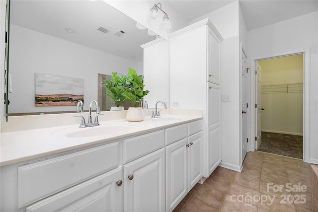 bathroom featuring vanity and tile patterned flooring