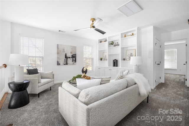 living room with ceiling fan and carpet floors