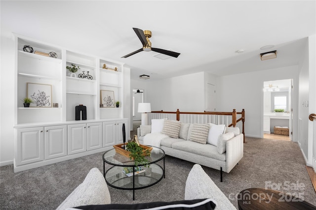 living room featuring ceiling fan and carpet