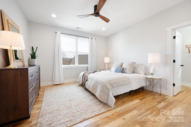 bedroom featuring light hardwood / wood-style flooring and ceiling fan