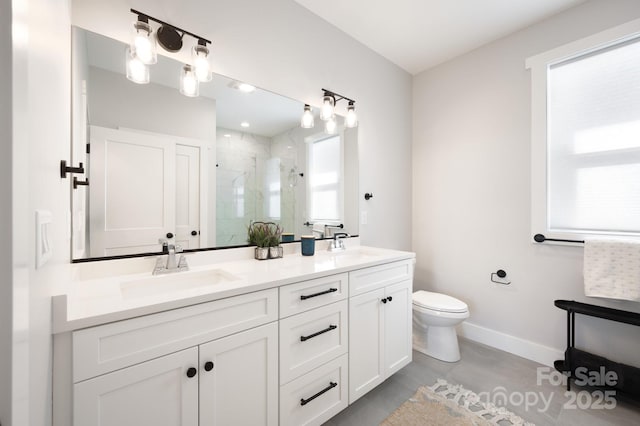 bathroom with vanity, toilet, and an enclosed shower