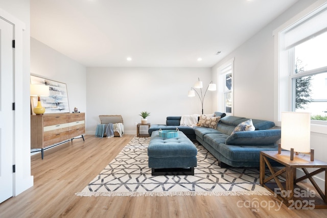 living room with light hardwood / wood-style floors