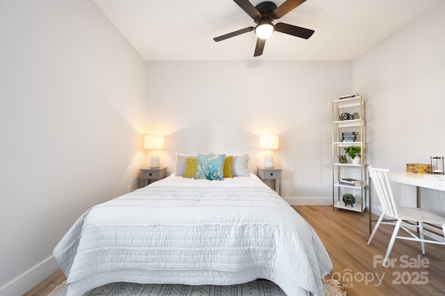 bedroom featuring ceiling fan and light hardwood / wood-style flooring