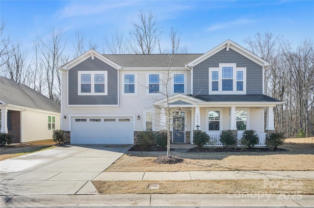 view of front of property with a garage and covered porch