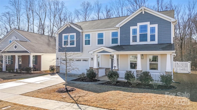 view of front of house with a garage and covered porch