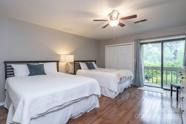 bedroom featuring hardwood / wood-style floors, access to outside, ceiling fan, and a closet