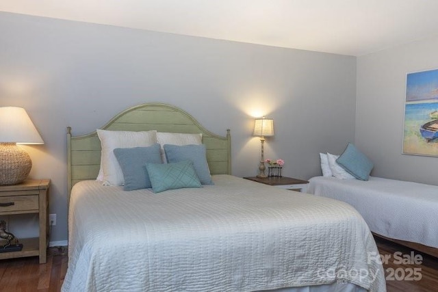 bedroom with wood-type flooring