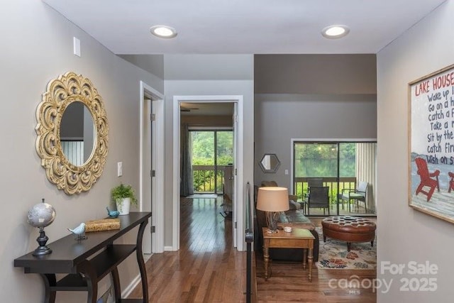 hallway with dark hardwood / wood-style flooring