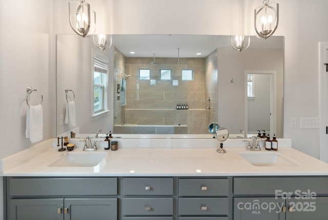 bathroom featuring vanity and tiled shower