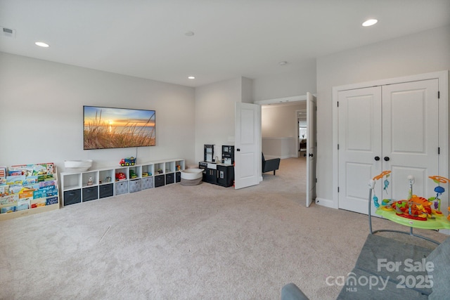 playroom featuring light colored carpet