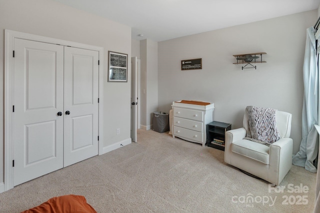 living area with light colored carpet