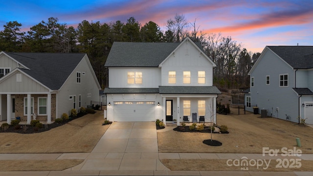 4159 Millstream Rd, Denver, NC 28037 - traditional home with a shingled roof, covered porch, a garage, board and batten siding, and concrete driveway