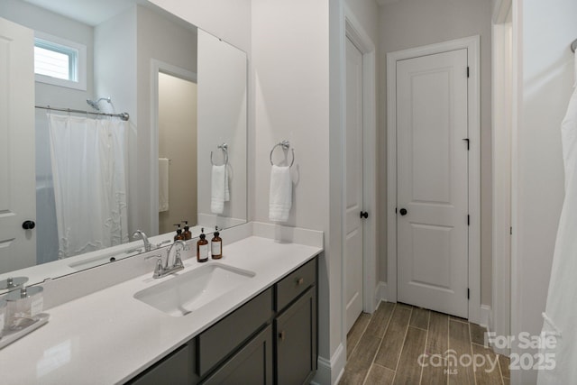 4159 Millstream Rd, Denver, NC 28037 - bathroom featuring baseboards, vanity, and wood finished floors