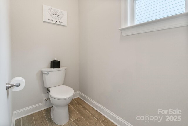 4159 Millstream Rd, Denver, NC 28037 - bathroom with baseboards, wood tiled floor, and toilet