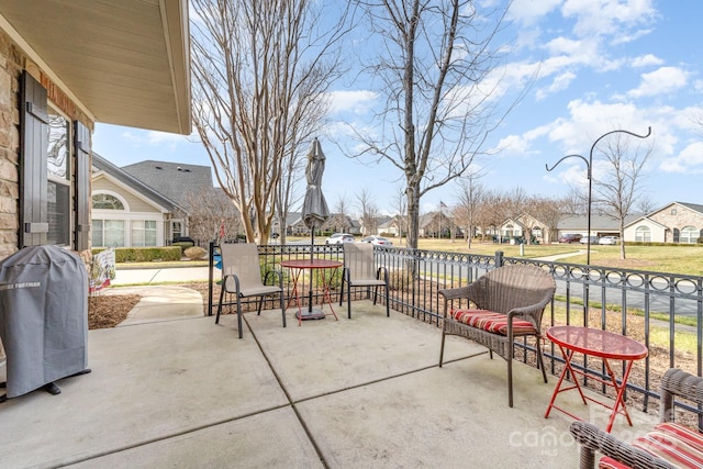 view of patio with a residential view and area for grilling