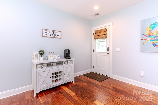 foyer featuring dark hardwood / wood-style floors