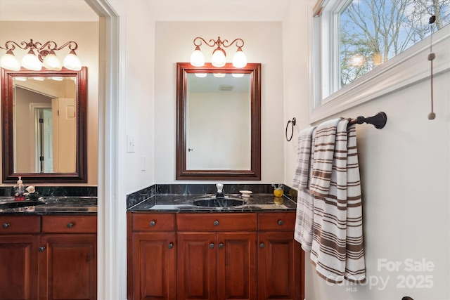 bathroom with two vanities and a sink