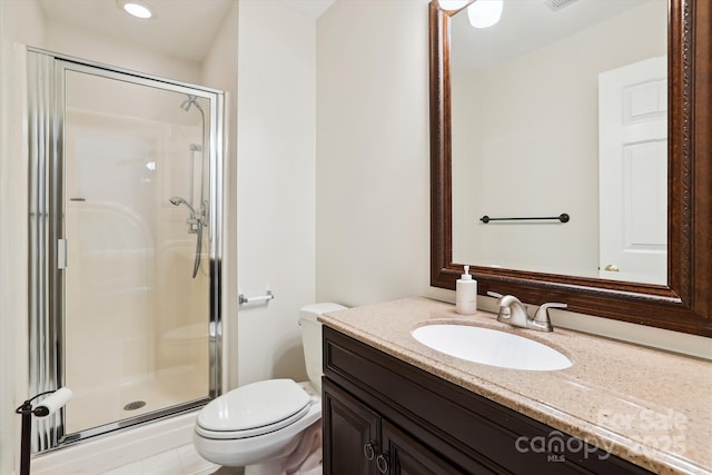 bathroom with toilet, a stall shower, visible vents, and vanity