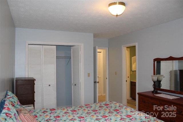 bedroom featuring a closet and a textured ceiling