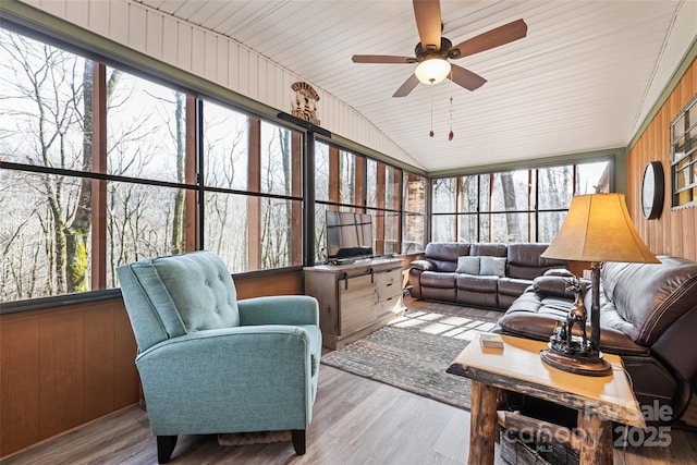 sunroom / solarium with lofted ceiling and ceiling fan