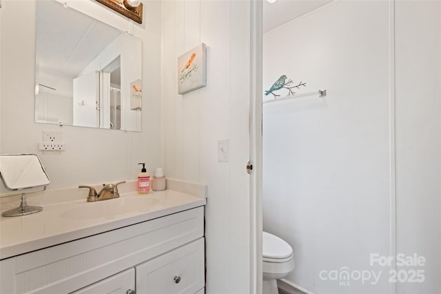 bathroom with vanity and toilet