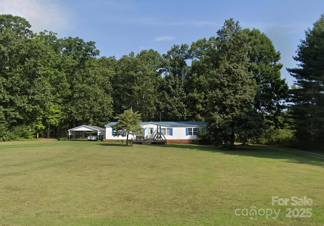 view of yard featuring a carport