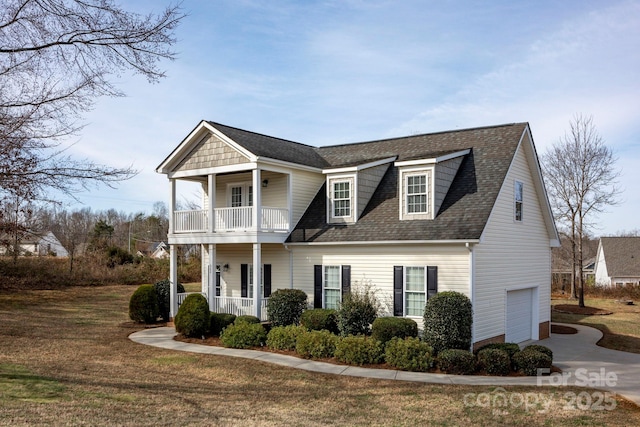 662 Georgie St, Troutman, NC 28166 - view of front of property featuring covered porch, a garage, a balcony, concrete driveway, and a shingled roof
