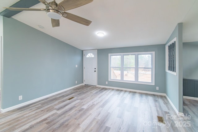 interior space featuring vaulted ceiling, ceiling fan, and light wood-type flooring