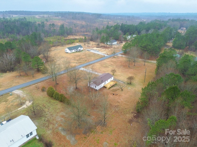 birds eye view of property featuring a rural view