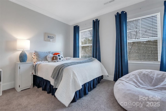 bedroom featuring carpet floors, visible vents, and baseboards