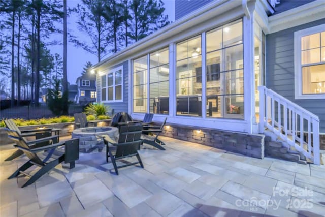 view of patio with an outdoor fire pit