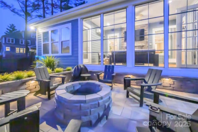 view of patio featuring an outdoor fire pit