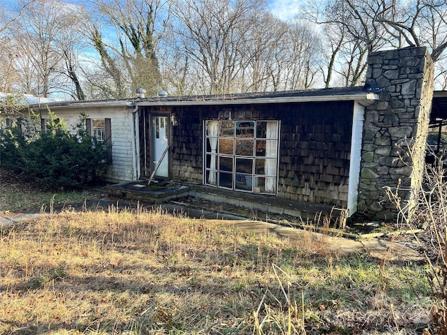 view of front of property featuring a chimney