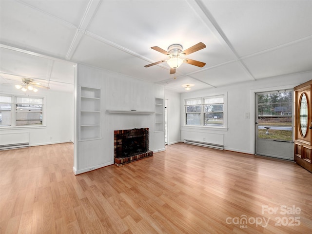 unfurnished living room with light hardwood / wood-style flooring, a baseboard radiator, built in features, and a healthy amount of sunlight