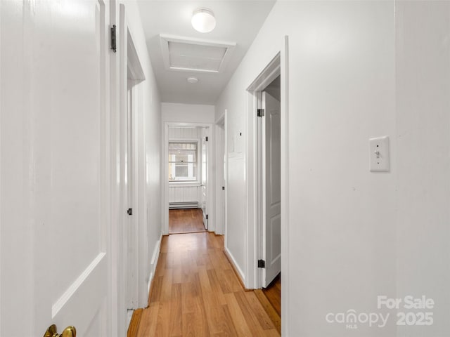 corridor with light wood-type flooring