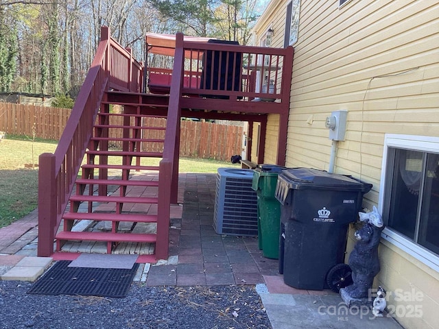 view of patio featuring a wooden deck and central AC unit